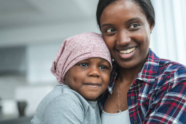 istock Supportive mother holds child with cancer 1175802807