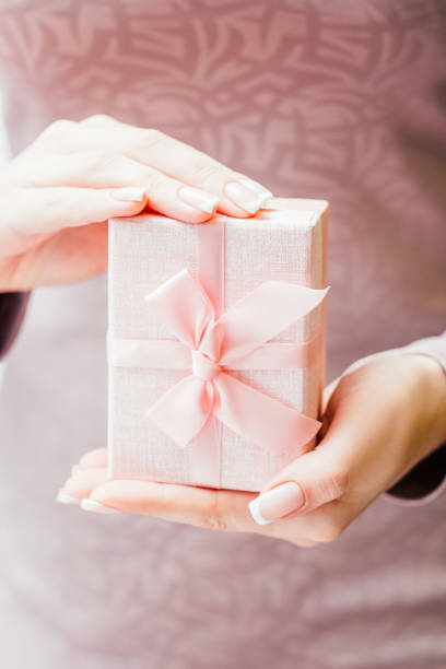 istock woman special occasion present lady pink gift box 1175802896