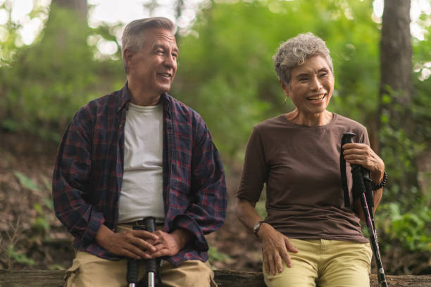 istock Senior couple resting while on a hike in the forest 1175803691