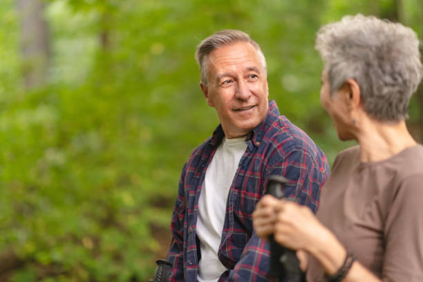 istock Senior couple resting while on a hike in the forest 1175803695