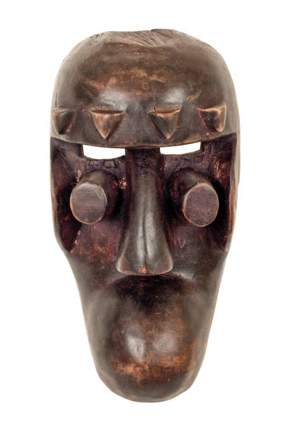 Grebo mask from Mali, carved in wood isolated on white.