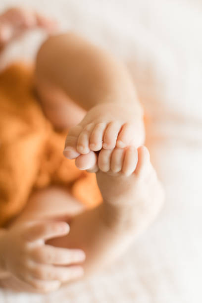 istock Autumn Baby Feet 1175810828
