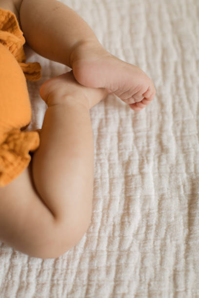 istock Autumn Baby Feet 1175810854