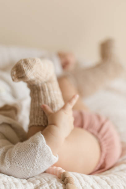 istock Autumn Baby Feet 1175810907