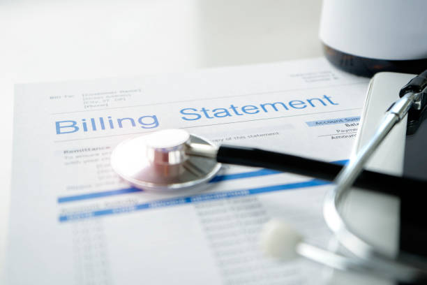 Health care billing statement. Health care billing statement with stethoscope, bottle of medicine for doctor's work in medical center stone background. diagnostic medical tool photos stock pictures, royalty-free photos & images