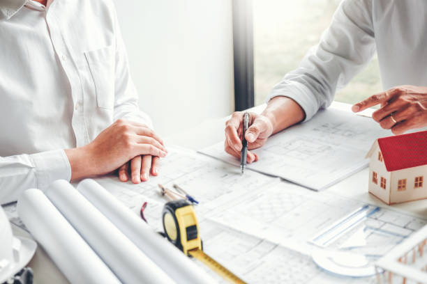 istock Team Engineer drawing graphic planning and meeting for architectural project on workplace 1175812606