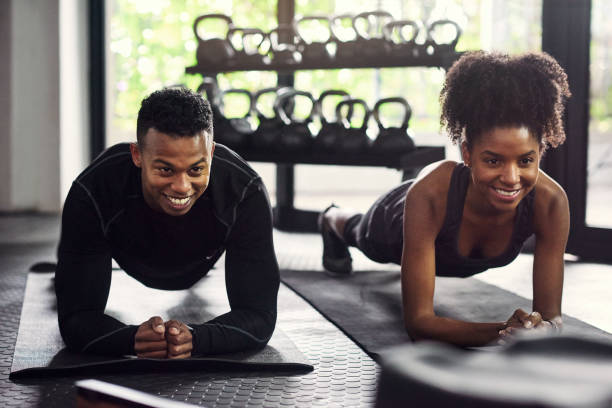 Partners In Life And Fitness Stock Photo - Download Image Now - Gym, Health Club, Exercising - iStock