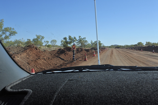 Derby, Western Australia - September 02 2019:Road work in Kimberley Western Australia. Australia relies heavily on road transport due to Australia's large area and low population density in considerable parts of the country