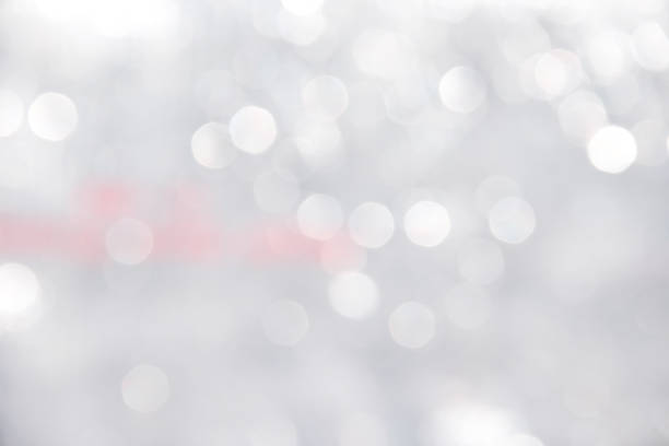 istock White or gray  bokeh sparkle glitter abstract patterns for Christmas and Happy new year background 1175817531