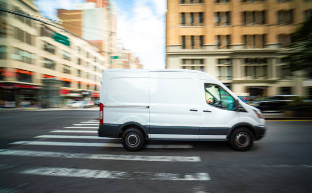 istock White delivery van in Manhattan New York 1175818570