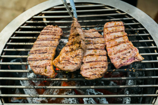 istock roast beef on barbecue grill. 1175818619