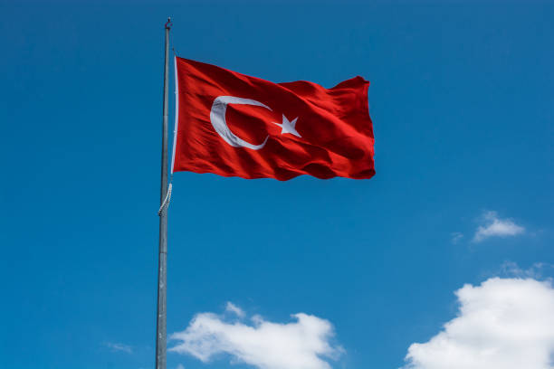 istock Turkish national flag with white star and moon in sky 1175822156