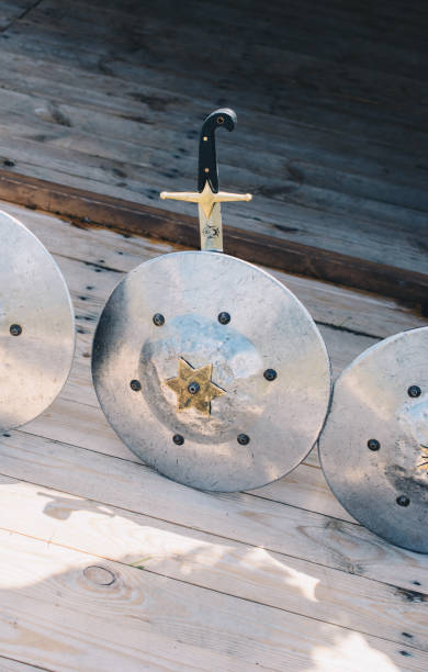 istock Shiny steel shields and knives on display 1175822266