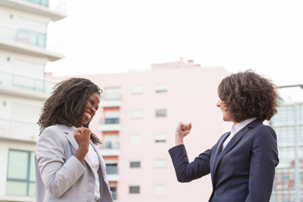 istock Cheerful businesswomen triumphing 1175825259