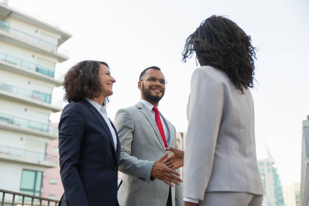 istock Group of confident business partners greeting each other 1175826225