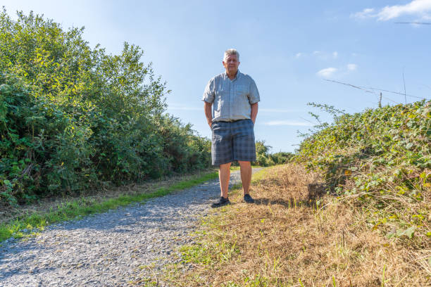 istock Senior Caucasian man in grass path 1175826330