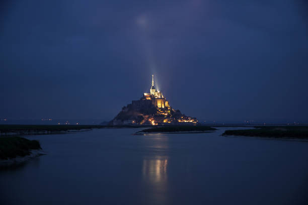 istock Dusk at Mont St Michel with illuminated cloud 1175827121