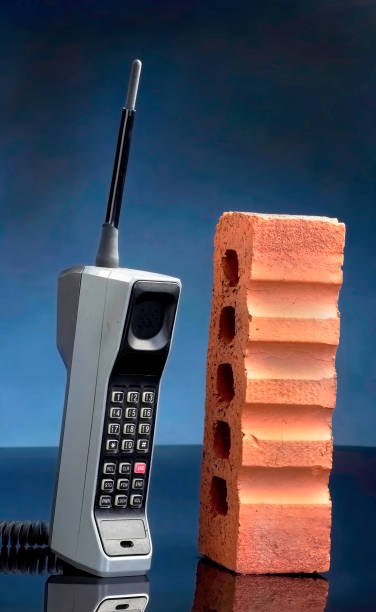 Old Brick Cell Phone. Old cell phone called the brick phone made in the early 1980's. 1980 stock pictures, royalty-free photos & images