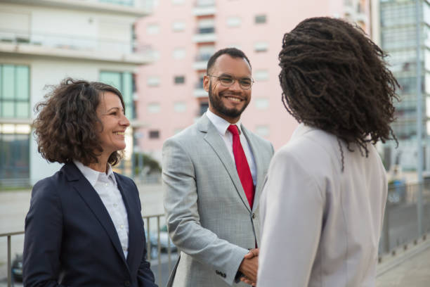 istock Agent meeting clients near office building 1175829856