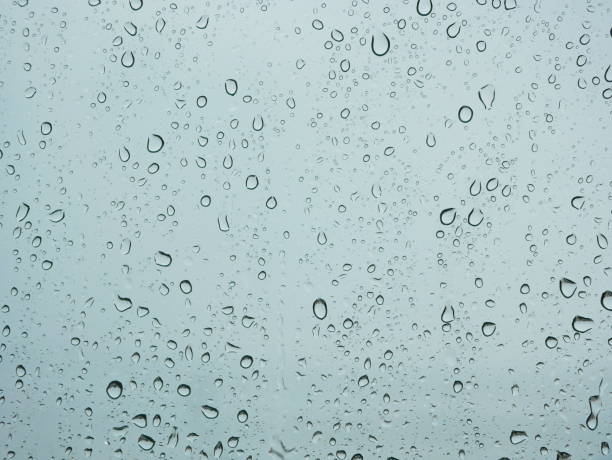 istock Rain droplets on a car's window on a rainy day - driver's perspective 1175832329