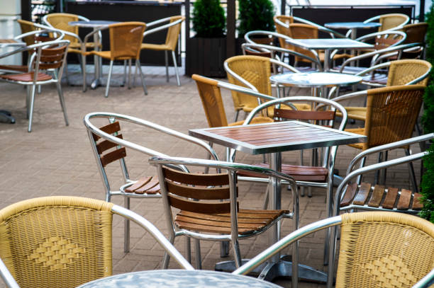istock Empty chairs and tables have not yet opened a cafe. Background 1175832405