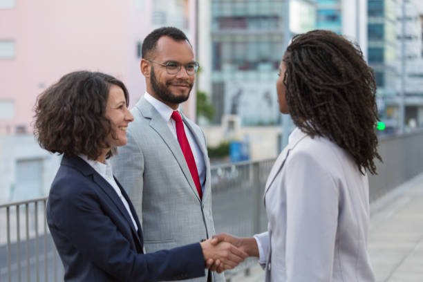 istock Happy friendly business colleagues greeting each other 1175832571