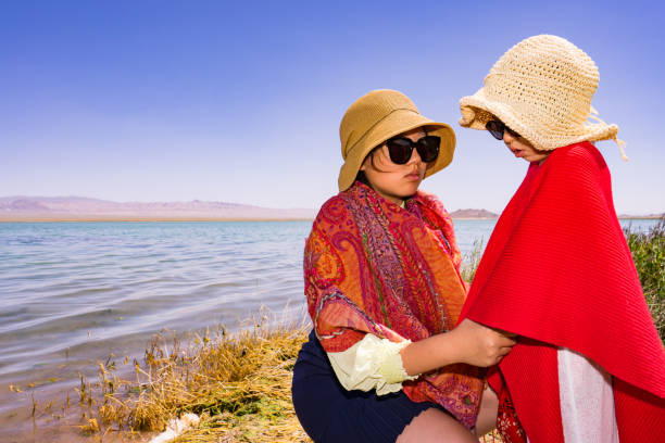 two sisters by the lake side