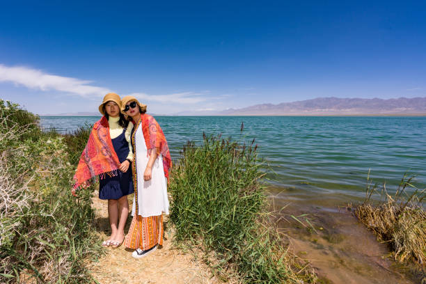 mother and daughter by the lake side