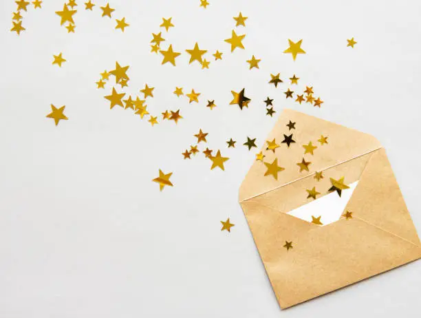 Photo of Envelope, blank card and confetti