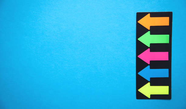 istock Colorful arrows on blue background. 1175836111