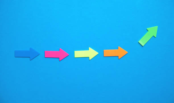 istock Colorful arrows on blue background. 1175836120