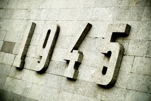 Relief panel with numerals. 1945 relief panel on a grey marble wall. World War II monument. Relief panel with numerals. 1945 relief panel on a grey marble wall. World War II monument. 1945 stock pictures, royalty-free photos & images