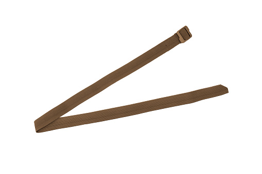 Brown nylon fastening belt, strap isolated on white background.