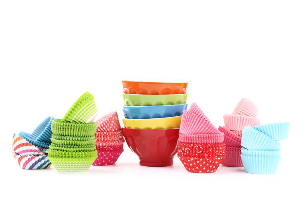 istock Cupcake cases with colorful bowls on white background 1175848949