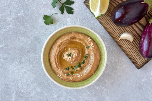 istock Traditional  eggplant hummus baba ganoush wit ingredients. Middle Eastern cuisine. Top view, overhead 1175848990