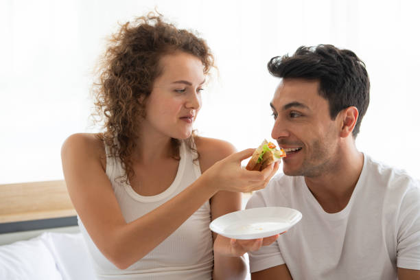 istock Happy couples relaxing in the white bedroom 1175850341