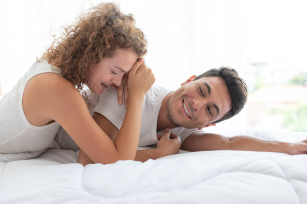 istock Happy couples relaxing in the white bedroom 1175850391