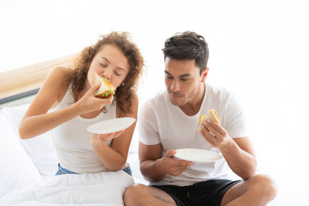 istock Happy couples relaxing in the white bedroom 1175850546