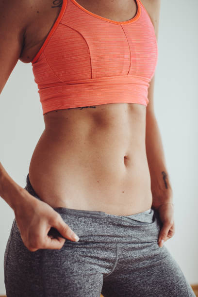 istock Young female woman workout at home 1175850690