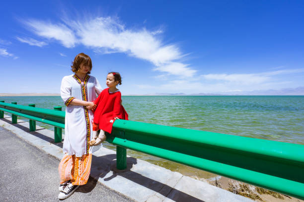 mother and daughter by the lake side