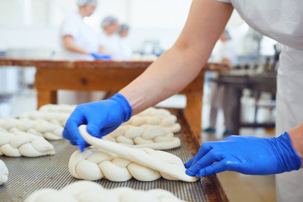 istock Raw baked dough lies on the table before baking at the bakery. 1175853429