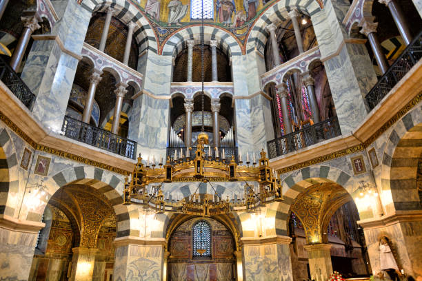 Barbarossa Chandelier in Aachen Cathedral The Barbarossa chandelier installed under the cupola of the Palatine Chapel in Aachen Cathedral, Germany. Composite photo aachen photos stock pictures, royalty-free photos & images