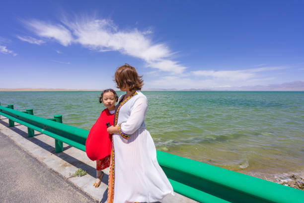 mother and daughter by the lake side
