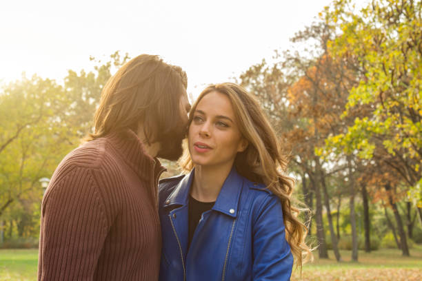 istock Couple in the park enjoying nice autumn time. 1175860404