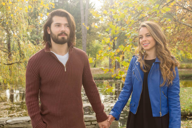 istock Couple in the park enjoying nice autumn time. 1175862274
