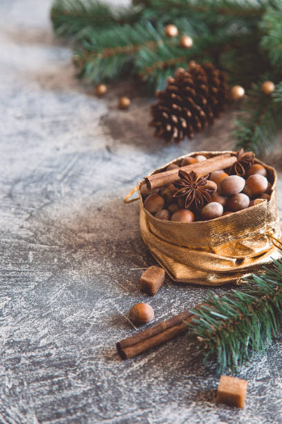 istock Christmas composition with nuts, cones, cinnamon sticks and anise. greeting card. 1175862614