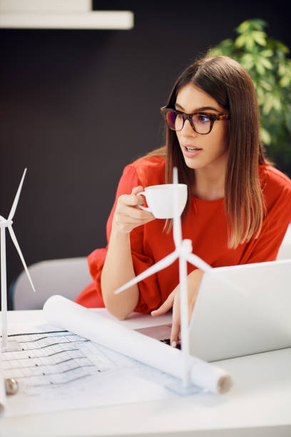 istock Woman drinking coffee in office. 1175862784