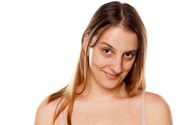 istock Young  smiling woman without makeup on white background 1175864046