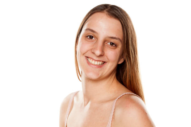 istock Young  smiling woman without makeup on white background 1175864054