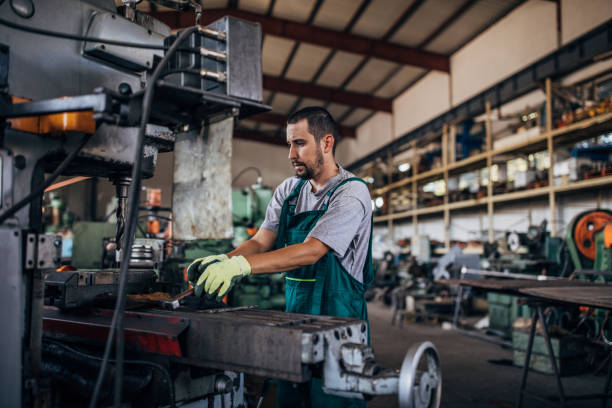 istock Man working in metal factory 1175864502
